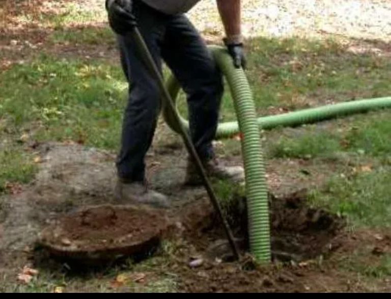 man emptying a septic tank